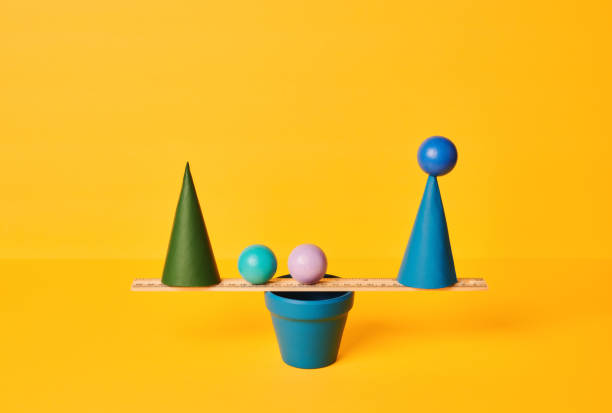 istock Conceptual Image of Work Life Balance with Yellow Background 1347172499