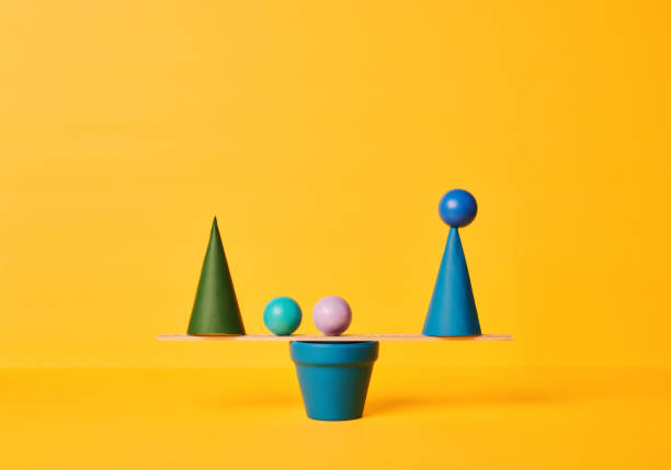 istock Conceptual Image of Work Life Balance with Yellow Background 1347172532