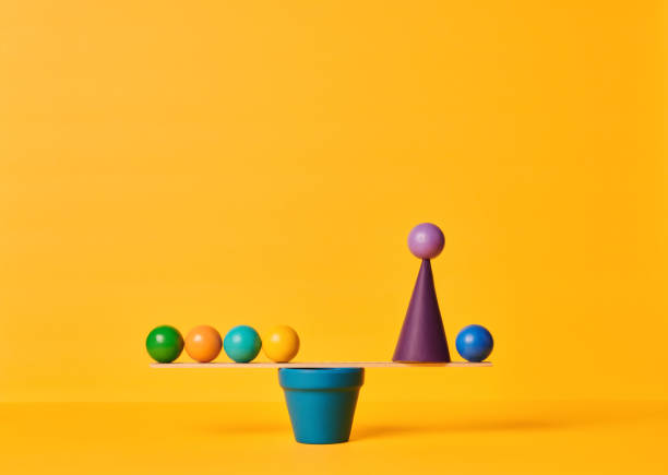 istock Conceptual Image of Work Life Balance with Yellow Background 1347172568
