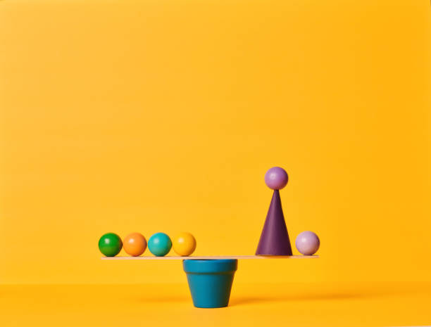 istock Conceptual Image of Work Life Balance with Yellow Background 1347172599