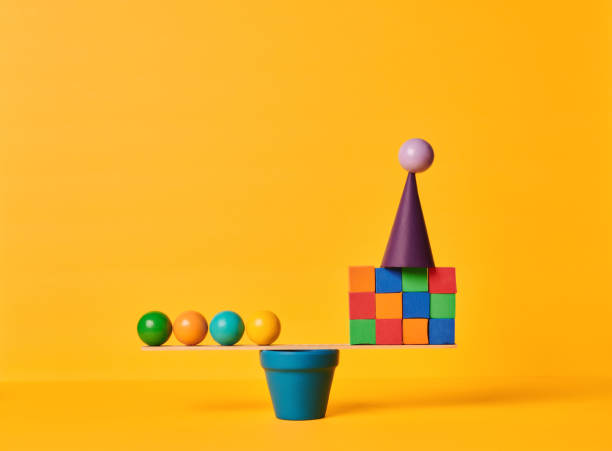 istock Conceptual Image of Work Life Balance with Yellow Background 1347172601
