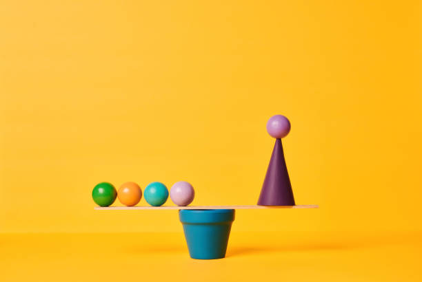 istock Conceptual Image of Work Life Balance with Yellow Background 1347173579