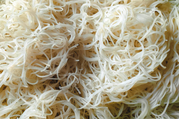 Vermicelli noodles in a yellow plastic basket