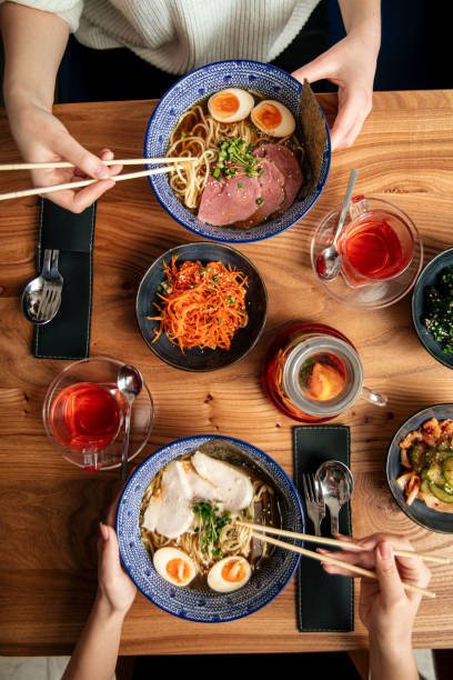istock Two people eat japanese ramen noodle soups 1347175513