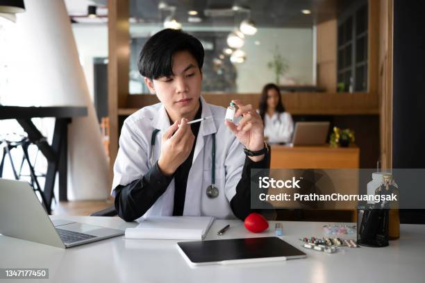 Doctor Holding Syringe And Bottle Of Vaccine Healthcare And Medical Concept Stock Photo - Download Image Now