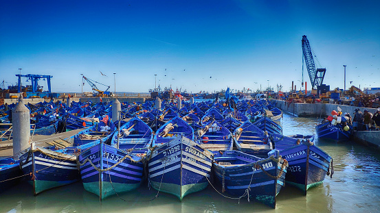 Harbor of old city of Essaouira with blue fishing boat in Morocco