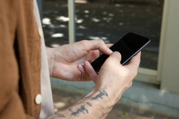 istock Male hands holding smartphone 1347188955
