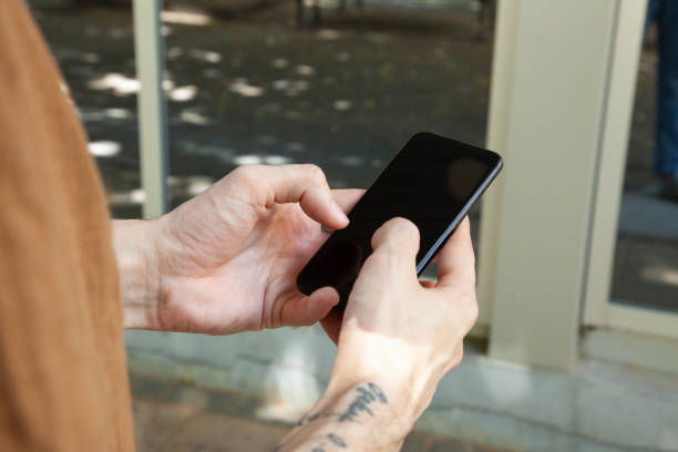 istock Male hands holding smartphone 1347188972