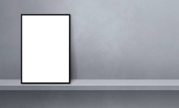 istock Black picture frame leaning on a grey shelf. 3d illustration. Horizontal banner 1347189323