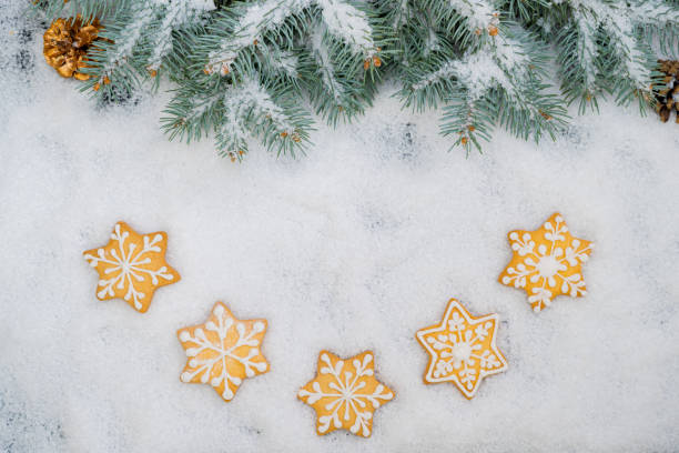 istock Pattern of gingerbread cookies in different shapes on a dark surface. Top view, flat lay. 1347190123