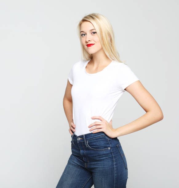 istock Young cute smiling blond woman wearing white t-shirt 1347190843