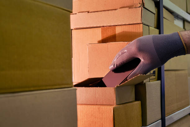 istock Theft of a phone from a box in a warehouse when sent by mail 1347191304