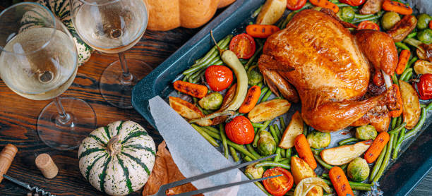 istock romantic dinner for two of baked chicken and baked vegetables 1347192544