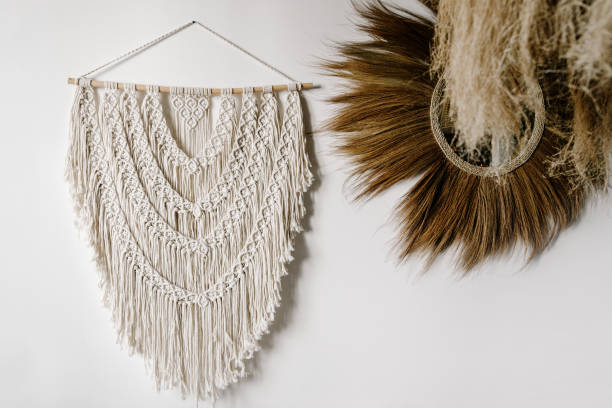 istock White handmade macrame hanging on wall near mirror 1347193283