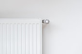 New modern radiator against white copy space wall