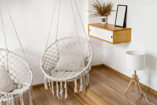 istock Room with cushions on hanging rope swings 1347193386