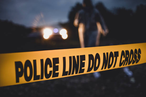 Forensic Science Police units react on the spot. A horrible crime near the river. Police line Do not cross crime scene stock pictures, royalty-free photos & images