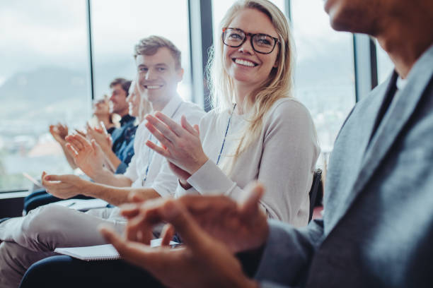 istock Group of businesspeople clapping hands at seminar 1347197532