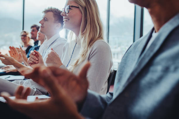 istock Businesspeople clapping hands after successful conference 1347197596