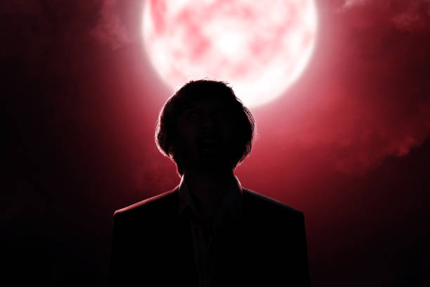 istock Scary zombie with blood and wound on his body standing 1347198888