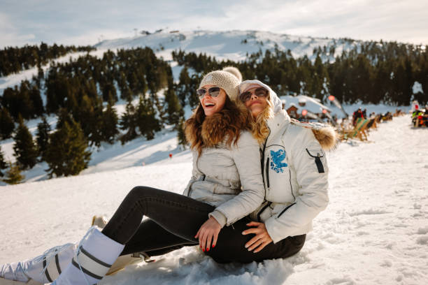 istock Happy female friends having fun during winter vacation 1347199854