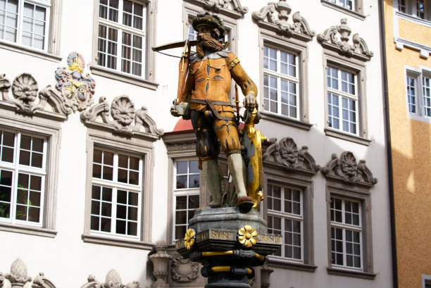 Fountain with statue of historic soldier with weapon at the old town of City of Schaffhausen. Photo taken September 25th, Schaffhausen, Switzerland.
