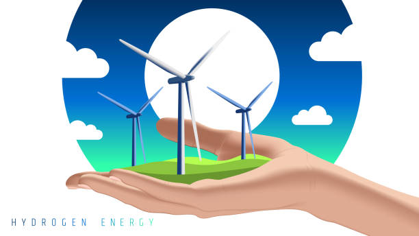 istock Wind turbines on hand. Green hydrogen: an alternative that reduces emissions and cares for our planet (H2O) 1347203927