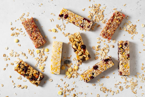 istock Nuts and oats energy mix bars on white background 1347204073