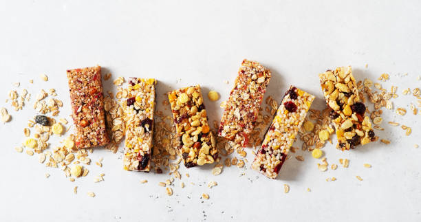 istock Nuts and oats energy mix bars on white background 1347204074