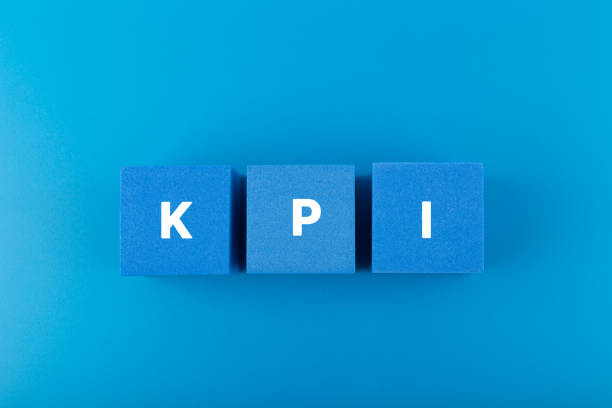 istock KPI letters on blue toy cubes against dark blue background with copy space 1347205771