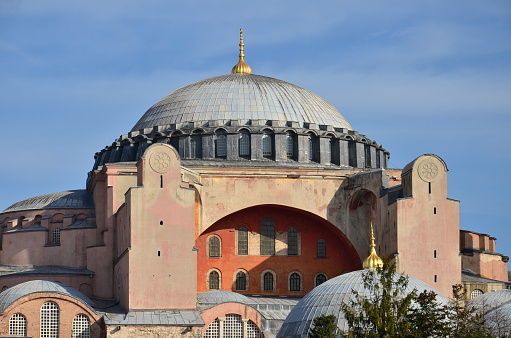 Hagia Sophia (Turkish: Ayasofya; Koinē Greek: Ἁγία Σοφία, romanized: Hagía Sophía; Latin: Sancta Sophia, lit. 'Holy Wisdom'), officially the Holy Hagia Sophia Grand Mosque (Turkish: Ayasofya-i Kebir Cami-i Şerifi), and formerly the Church of Hagia Sophia (Turkish: Ayasofya Kilisesi; Greek: Ναός της Αγίας του Θεού Σοφίας; Latin: Ecclesia Sanctae Sophiae), is a Late Antique place of worship in Istanbul, designed by the Greek geometers Isidore of Miletus and Anthemius of Tralles. Built in 537 as the patriarchal cathedral of the imperial capital of Constantinople, it was the largest Christian church of the eastern Roman Empire (the Byzantine Empire) and the Eastern Orthodox Church, except during the Latin Empire from 1204 to 1261, when it became the city's Latin Catholic cathedral. In 1453, after the Fall of Constantinople to the Ottoman Empire, it was converted into a mosque. In 1935, the secular Turkish Republic established it as a museum. In 2020, it re-opened as a mosque.