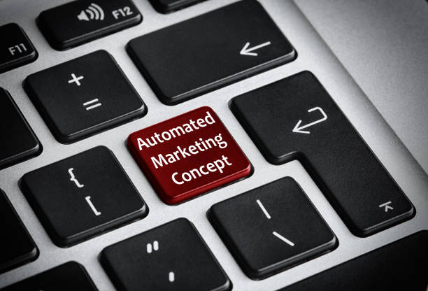 istock Modern laptop keyboard with text AUTOMATED MARKETING CONCEPT on button, closeup 1347207519