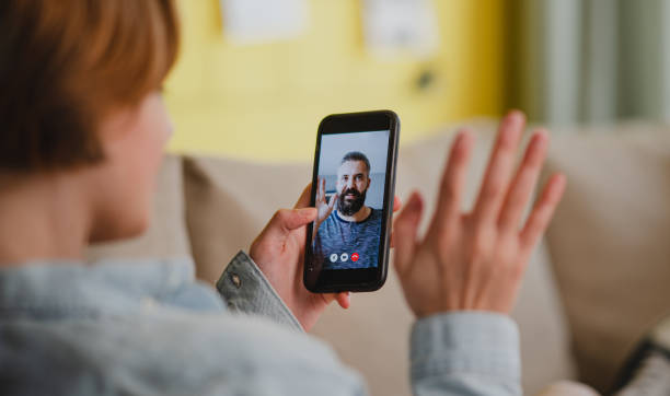 istock Young woman at home making video call using smartphone, social networks concept. 1347207805