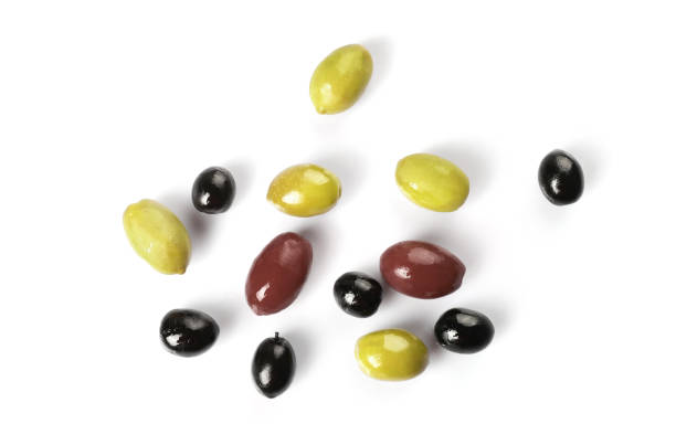 istock Green, red and black olives isolated on white background 1347207958