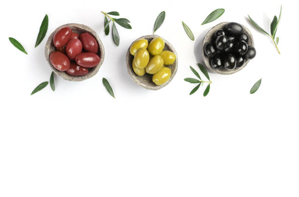 istock Green, red and black olives in bowls isolated on white background 1347207984