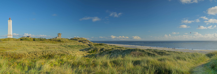 Panorama view of Blåvand lighthouse on wide dune of Blåvandshuk with beach view on the west coast of Jutland, by Esbjerg, Denmark.