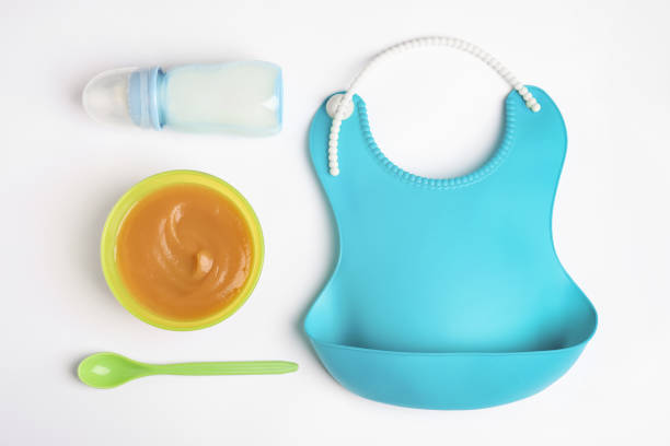 istock Flat lay composition with baby food and accessories on white background 1347209047