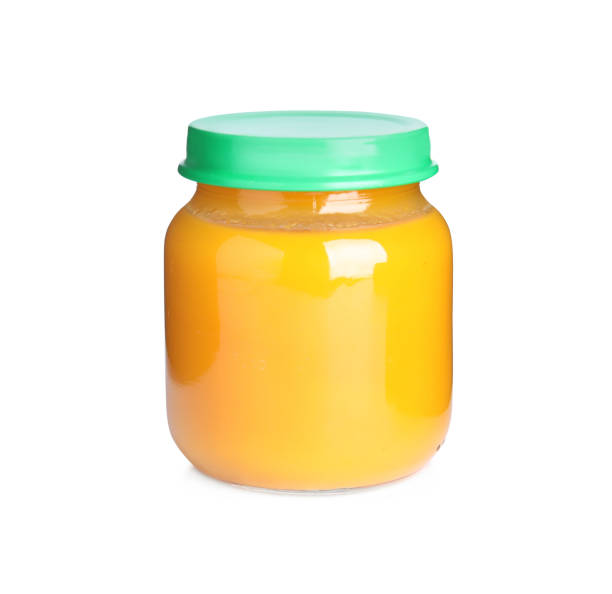Jar with baby food isolated on white Jar with baby food isolated on white baby food stock pictures, royalty-free photos & images