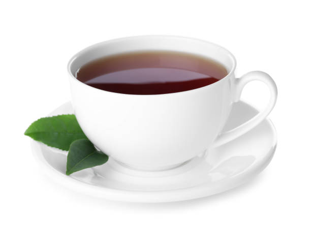 istock Fresh black tea and green leaves isolated on white 1347209664