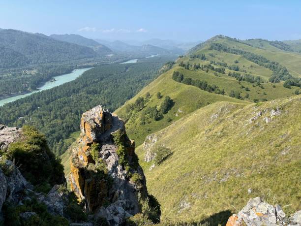istock Mountain peak Devil's finger and dense forest in the valley, against the backdrop of mountains 1347209800