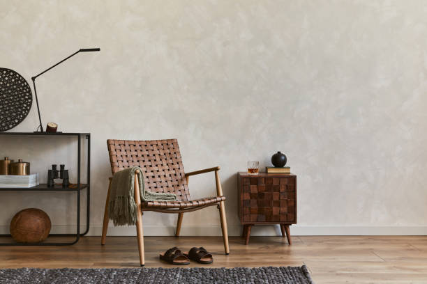 istock Creative elegant composition of masculine living room interior design with copy space, brown armchair, designed commode, industrial shelf and personal accessories. Template. 1347210982