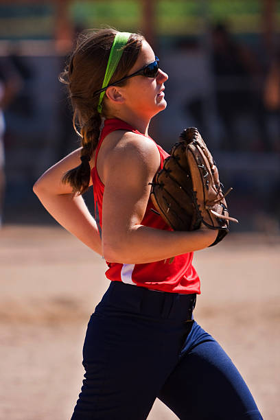 istock Female Softball Player Runs Off Field 134721125