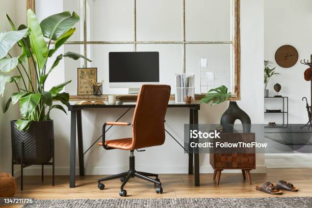 Creative Workspace Composition Of Modern Masculine Home Office Interior With Black Industrial Desk Brown Leather Armchair Laptop Vintage Record Player And Stylish Personal Accessories Template Stock Photo - Download Image Now
