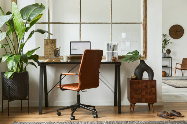 istock Creative workspace composition of modern masculine home office interior with black industrial desk, brown leather armchair, laptop, vintage record player and stylish personal accessories. Template. 1347211735