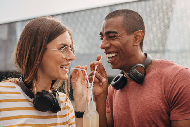 istock Couple drinking soda together 1347212514