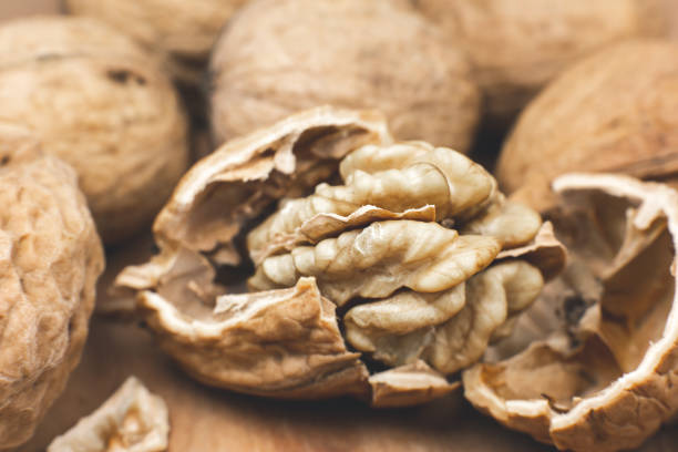 istock Crushed Walnut on the wood background. Close up. 1347215108