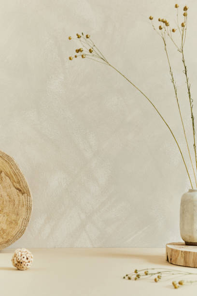 istock Minimalistic composition of cozy interior design with copy space, natural materials as wood and marble, dry plants and personal accessories. Neutral beige colors, template. 1347216008