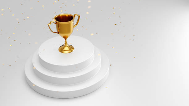 istock Winners golden cup on a podium 1347216984