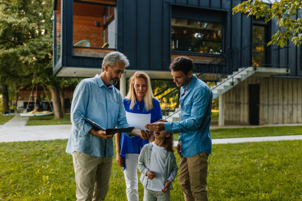 istock Family talking with real estate agent 1347218657