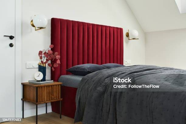 Minimalistic Elegant Bedroom Interior With Red Bed Grey Bedclothes And Wooden Furniture Glamour Style Inspiration Template Stock Photo - Download Image Now